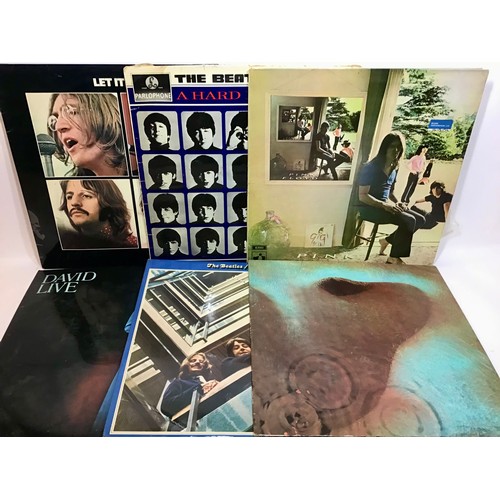 188 - BOX OF VARIOUS ROCK AND POP ALBUMS AND SINGLES. Found here we have a varied collection of artist’s t... 