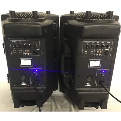 498 - 2 X QTX PA POWERED SPEAKERS. These are model number QR12K and both power up when plugged in.