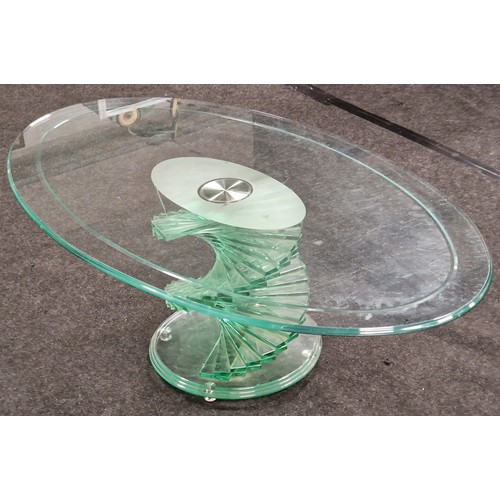 539 - Contemporary glass oval coffee table on stepped twisted glass base 42x120x70cm.