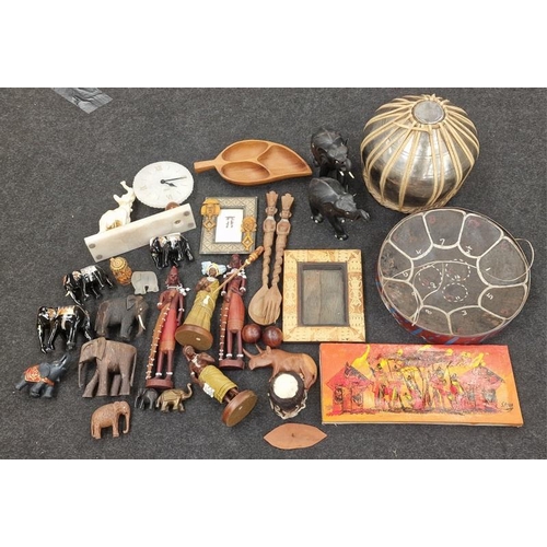 94 - Large quantity of African tribal items to include art work carvings and a drum