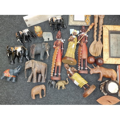 94 - Large quantity of African tribal items to include art work carvings and a drum