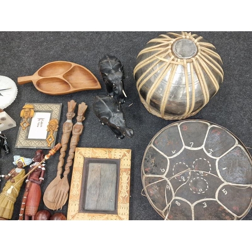 94 - Large quantity of African tribal items to include art work carvings and a drum