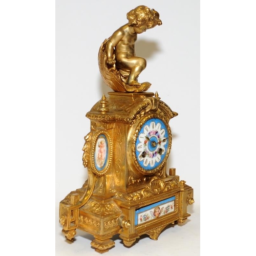 355 - Antique French ormolu striking mantel clock featuring hand painted porcelain panels with a cherub fi... 