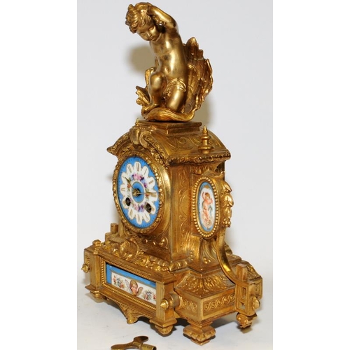 355 - Antique French ormolu striking mantel clock featuring hand painted porcelain panels with a cherub fi... 