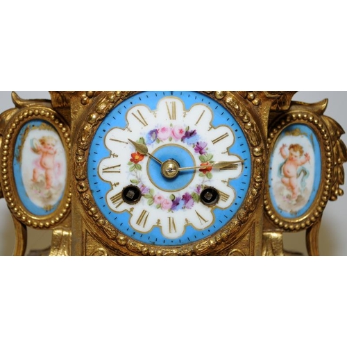 355 - Antique French ormolu striking mantel clock featuring hand painted porcelain panels with a cherub fi... 