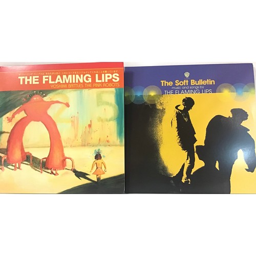 159 - THE FLAMING LIPS ALBUMS X 2. Here we have a copy of ‘Yoshimi Battles The Pink Robots’ and ‘The Soft ... 