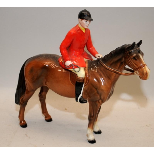 105 - Vintage Beswick Huntsman figure on a horse. 22cms tall