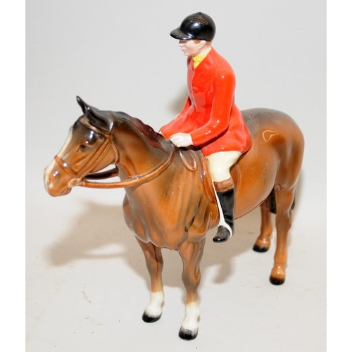 105 - Vintage Beswick Huntsman figure on a horse. 22cms tall