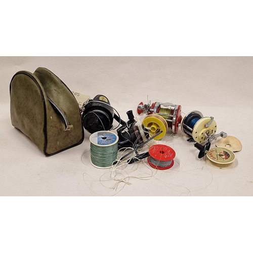 26 - Collection of fishing reels and line.