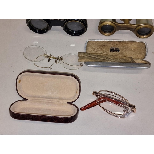 59 - Two pairs of cased opera glasses together with two pairs of spectacles (4).