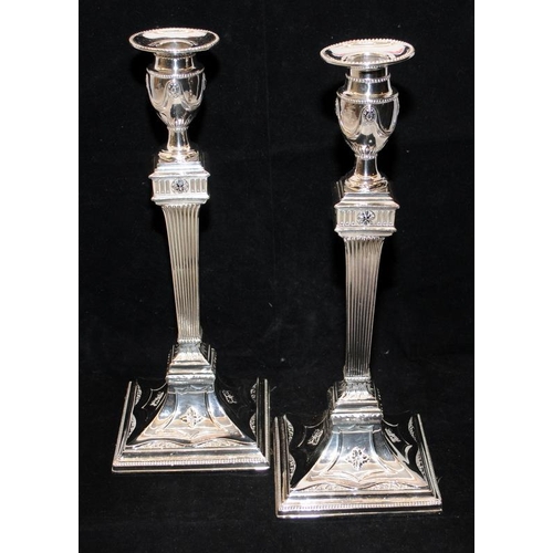 245 - Pair of imposing silver plated candlesticks in Georgian neo-classical style, 33cms tall