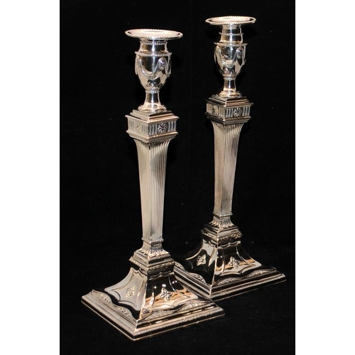 245 - Pair of imposing silver plated candlesticks in Georgian neo-classical style, 33cms tall