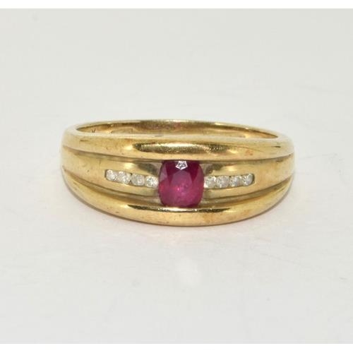 212 - 9ct gold Diamond and Ruby ring size P