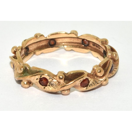 216 - 9ct gold ladies garnet set full eternity ring size O