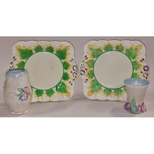 119 - Pair of Clarice Cliff sandwich plates together with two vases (4).