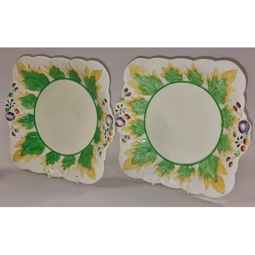 119 - Pair of Clarice Cliff sandwich plates together with two vases (4).