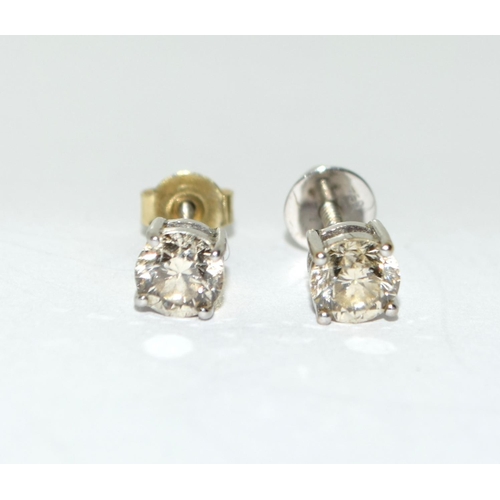 159 - Diamond earrings approx 0.33 points in each on 18ct gold mounts.