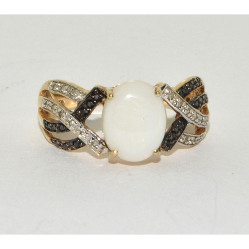 175 - Opal/black/white diamond and 9ct gold ring Size Q