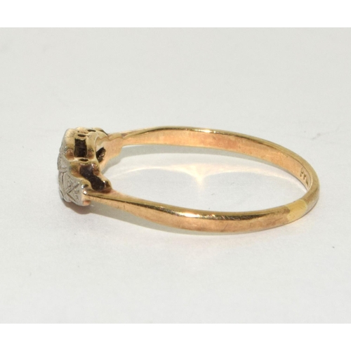 200 - An Edwardian 9ct gold and platinum diamond ring Size o.