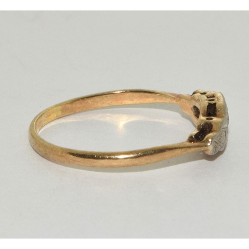 200 - An Edwardian 9ct gold and platinum diamond ring Size o.