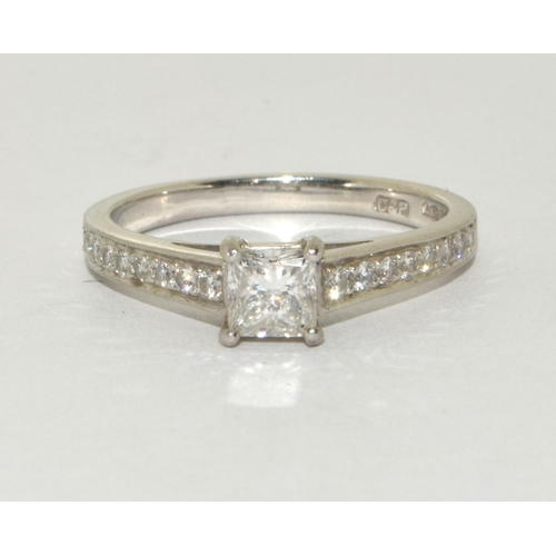 195 - A Platinum diamond square cut centre stone and diamond shoulder ring approx 0.50 points Size M