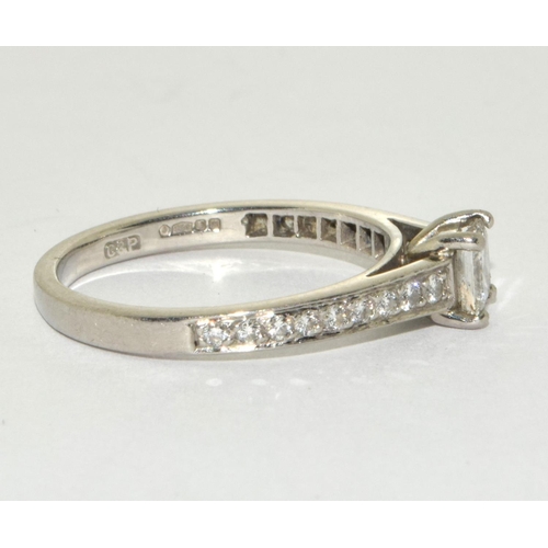 195 - A Platinum diamond square cut centre stone and diamond shoulder ring approx 0.50 points Size M