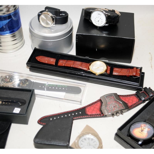 243 - A collection of gents fashion watches requiring new batteries. Mostly boxed