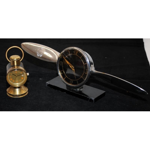 247 - Two vintage desk clocks, an Art Deco chrome example in the form of a propeller and another in the fo... 