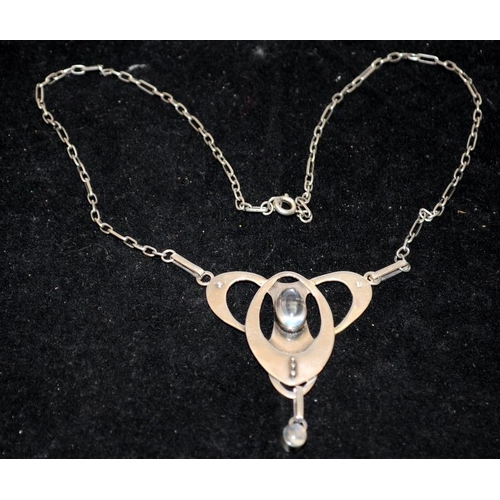 249 - White metal (unmarked) Art Nouveau pendant and chain with cabochon moonstones. Poss. Murrle Bennett.