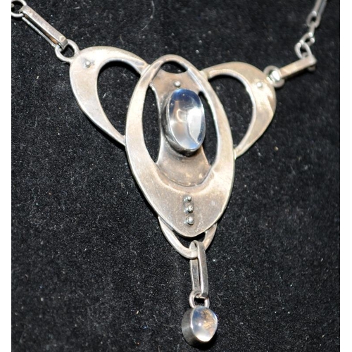 249 - White metal (unmarked) Art Nouveau pendant and chain with cabochon moonstones. Poss. Murrle Bennett.