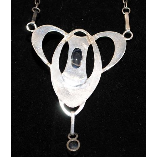 249 - White metal (unmarked) Art Nouveau pendant and chain with cabochon moonstones. Poss. Murrle Bennett.