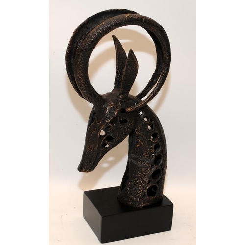 289 - Modernist cast metal sculpture of a horned animal's head. 37cms tall including plinth