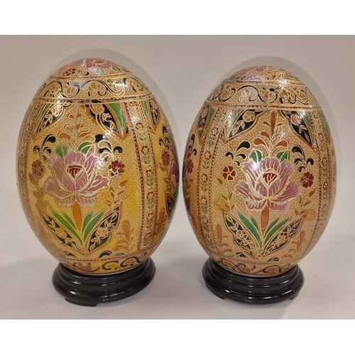 358 - Pair of porcelain eggs on wood stands