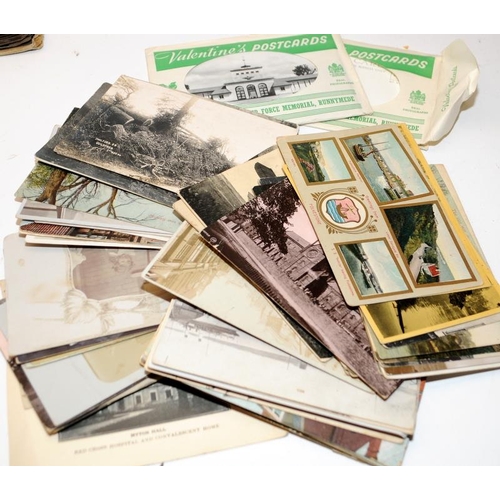 268 - Interesting collection of early postcards contained within an album, a lever file and some loose. In... 