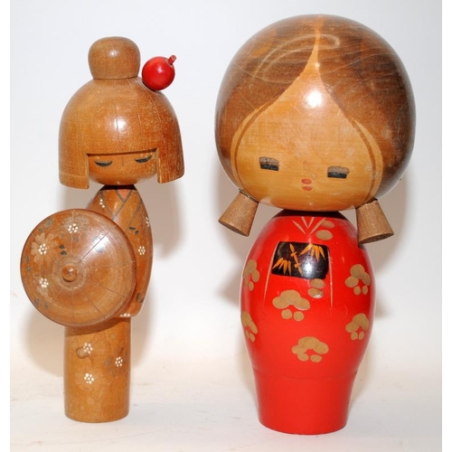 269 - Two vintage Japanese Kokeshi wooden dolls, the largest being 21cms tall