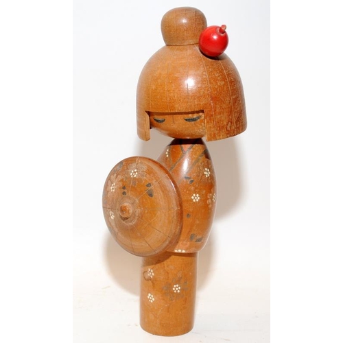 269 - Two vintage Japanese Kokeshi wooden dolls, the largest being 21cms tall