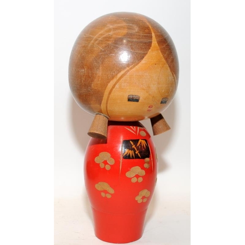 269 - Two vintage Japanese Kokeshi wooden dolls, the largest being 21cms tall