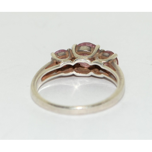 184 - A 925 silver and pink topaz trilogy ring Size P