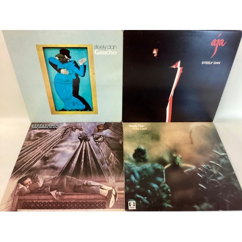 125 - STEELY DAN VINYL LP RECORDS X 4. Great selection here to include - Aja - Gaucho - Katy Lied - The Ro... 