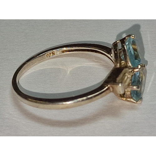 391 - A 925 silver , Cz and light blue stone ring, Size P