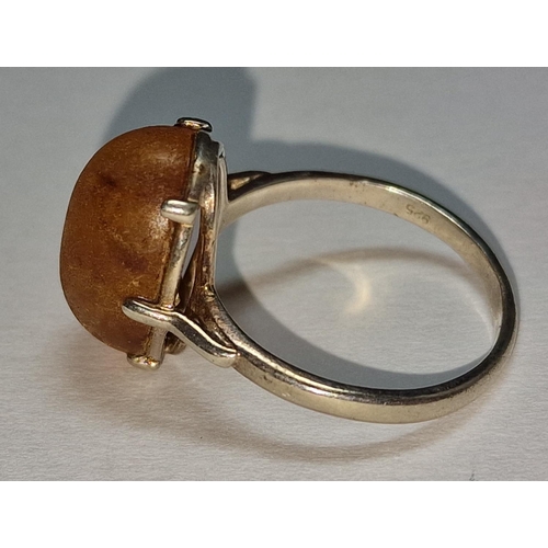 392 - A 925 silver and unpolished amber ring Size Q