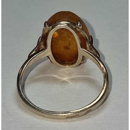 392 - A 925 silver and unpolished amber ring Size Q