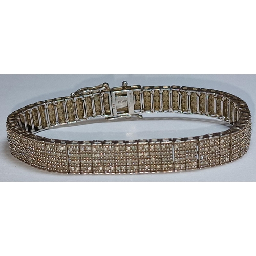 388 - A Diamond set silver bracelet.