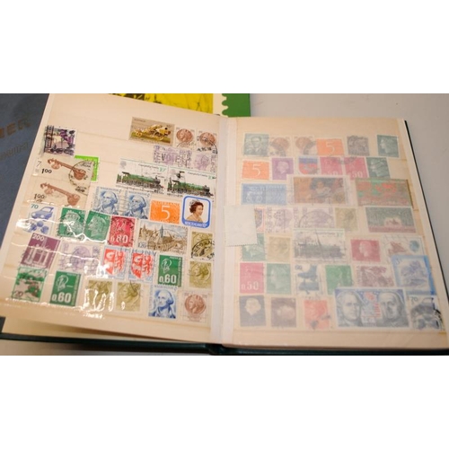 204 - A number of vintage schoolboy stamp albums with a good selection of world stamps