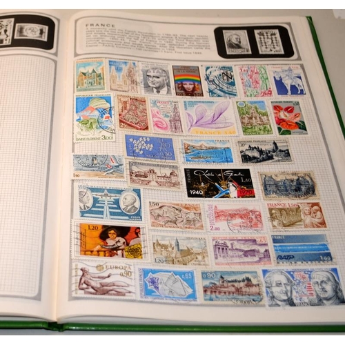 204 - A number of vintage schoolboy stamp albums with a good selection of world stamps