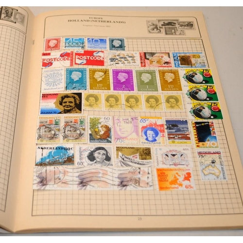 204 - A number of vintage schoolboy stamp albums with a good selection of world stamps