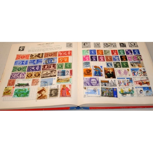 204 - A number of vintage schoolboy stamp albums with a good selection of world stamps