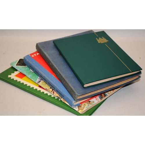 204 - A number of vintage schoolboy stamp albums with a good selection of world stamps