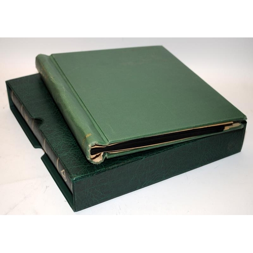 180 - Lighthouse Channel Islands green stamp album in slip case, part filled c/w another green album conta... 