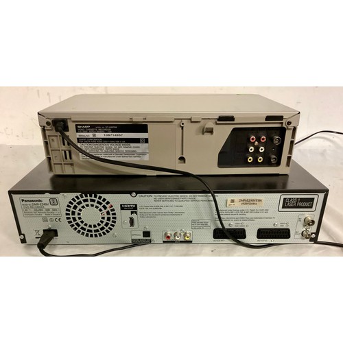 497 - 2 X VHS VIDEO PLAYERS. Here we have a Panasonic DMR-E749V combined VHS/DVD player and a Sharp VC-VH9... 